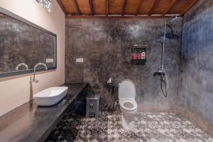 a bathroom with a sink and a toilet and a shower at Precious Journey Retreat in Ubud +48 photos