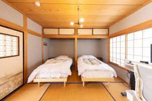 En eller flere senge i et værelse på 貸切宿ひととき