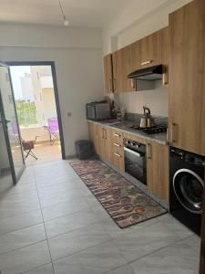 a kitchen with a sink and a stove top oven at Ocean Park Apartment for rent in Casablanca