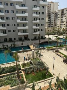 an apartment complex with a swimming pool and buildings at Ocean Park Apartment for rent in Casablanca
