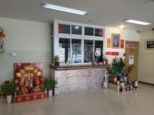 a store with a christmas display in a building at ฐิติกร แกรนด์วิว in Thanya Buri