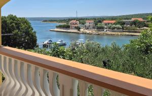 a view of a river from a balcony at Four-Bedroom Holiday Home Krusevo With Sea View 05 in Anić