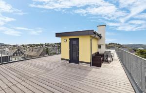 a roof deck with a yellow and black door at 5 Residenz Panoramablick in Winterberg