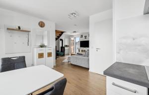 a kitchen and living room with a table and a couch at 5 Residenz Panoramablick in Winterberg