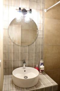 a bathroom with a sink and a mirror at Thomy's Apartment in Nea Michaniona in Nea Michaniona +3 photos