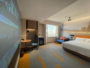 Postel nebo postele na pokoji v ubytování Hampton by Hilton Foshan Dali