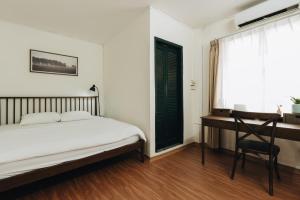 Postel nebo postele na pokoji v ubytování Dusk House