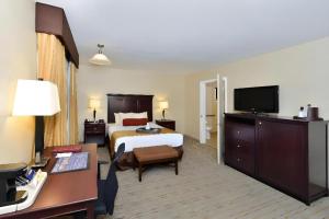 a hotel room with a bed and a desk at Best Western Frontier Motel in Lone Pine +150 photos