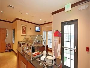 a large kitchen with a counter with a sink at Staybridge Suites Newport News in Newport News
