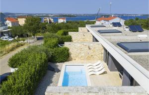 an outdoor swimming pool on the roof of a building at Villa K4 in Zadar