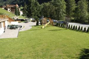 a park with a playground and a slide at Ferienwohnung & Spa Access Zimmerhofer in Cadipietra