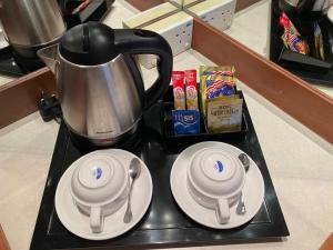Принадлежности для чая и кофе в Grand City Hotel
