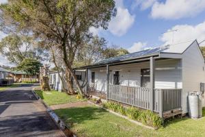 a house in a suburb with a street at Ocean Grove Holiday Park in Ocean Grove