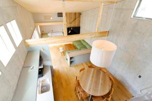 an overhead view of a kitchen and a table in a room at TUGBOAT Suite in Osaka