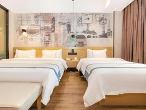 two beds in a room with drawings on the wall at City Comfort Inn Chongqing Jiangbei International Airport in Chongqing +111 photos
