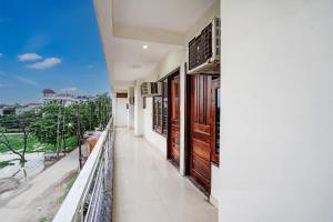 a balcony of a house with a view at Hotel O Golden Palace in Noida +26 photos
