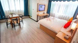 Postel nebo postele na pokoji v ubytování Jun Hotel Sichuan Chengdu South High-Tech Zone Yongfeng Road