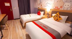 Postel nebo postele na pokoji v ubytování Jun Hotel Sichuan Chengdu South High-Tech Zone Yongfeng Road