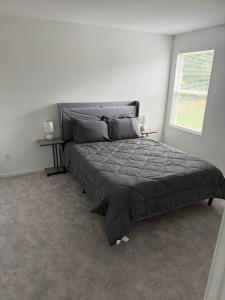 a bedroom with a large bed with two night stands at #Marbella Lane - Tranquil Escape in Texas Pines 