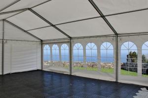 a large white tent with a view of the ocean at Aldeia do Priolo in Nordeste