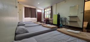Postel nebo postele na pokoji v ubytování P.L.P Guesthouse - Mae Hong Son