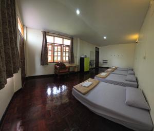 Postel nebo postele na pokoji v ubytování P.L.P Guesthouse - Mae Hong Son