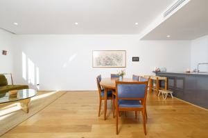 a dining room with a table and chairs at Retro Gallery Escape in the Heart of Braddon - Hosted by Canstay in Braddon