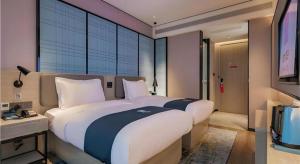 Televisyen dan/atau pusat hiburan di Echarm Hotel Xi'an Dayan Tower Datang Lively District