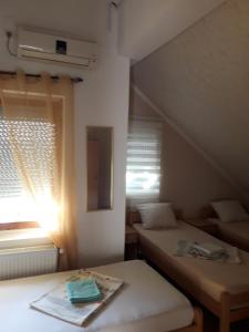 Postel nebo postele na pokoji v ubytování VILA NATALIJA APARTMANI