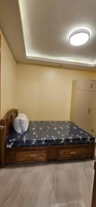 Cama grande en habitación con colchón en IBM Homestay, en Butuán