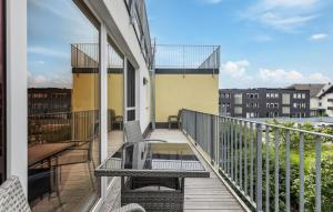 a balcony with a table and a view of the city at Gebirgsresort Winterberg in Winterberg