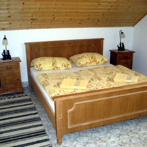 Кровать или кровати в номере Sarokhaz Panzio