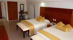 Postel nebo postele na pokoji v ubytování Celuisma Playa Dorada All Inclusive