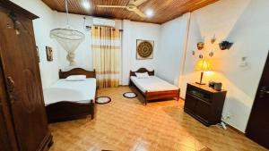 En eller flere senge i et værelse på Shell villa + 6 billeder