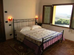 A bed or beds in a room at Agriturismo S. Apollinare