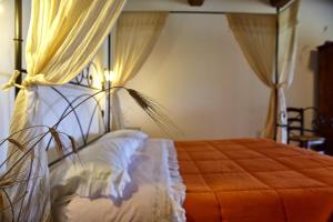 A bed or beds in a room at Agriturismo S. Apollinare