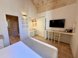 Postel nebo postele na pokoji v ubytování Vittorio Emanuele Charming Suites