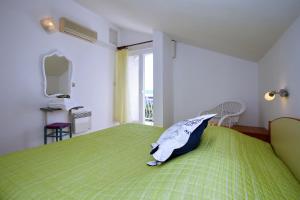 Ένα ή περισσότερα κρεβάτια σε δωμάτιο στο Rooms & Apartments Soline Nuove