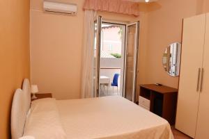 Postel nebo postele na pokoji v ubytování Hotel Costa d'Oro