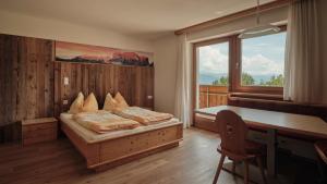 Ένα ή περισσότερα κρεβάτια σε δωμάτιο στο Bergdiamant