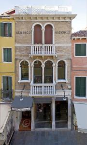 a building with a balcony on the side of it at Hotel Nazionale in Venice