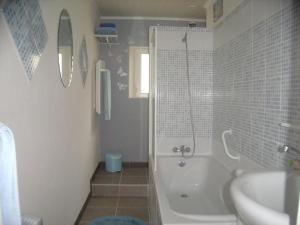 a bathroom with a shower and a tub and a sink at TOUTAPIé in Bergerac +11 photos