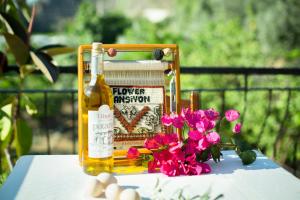 a bottle of honey and flowers on a table at Flower Hotel Patara in Patara