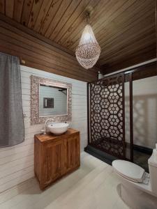 a bathroom with a sink and a mirror at Met House in Thulusdhoo +79 photos