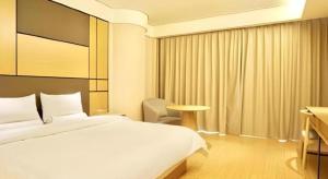 Postel nebo postele na pokoji v ubytování JI Hotel Shanghai Zhangjiang