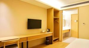TV a/nebo společenská místnost v ubytování JI Hotel Shanghai Zhangjiang