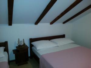 Katil atau katil-katil dalam bilik di Apartments Rino