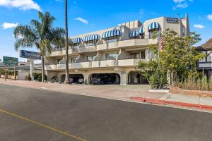 a building on a street in front of a road at Travelodge by Wyndham San Clemente Beach in San Clemente