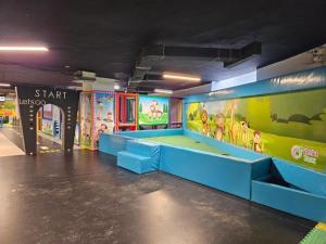 a room with a play floor in a building at Sea view and Aqua park Apartments at Caesar Blue Complex in Iskele