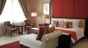 a hotel room with a bed and a couch at Hotel Ammi Cepu in Cepu +66 photos